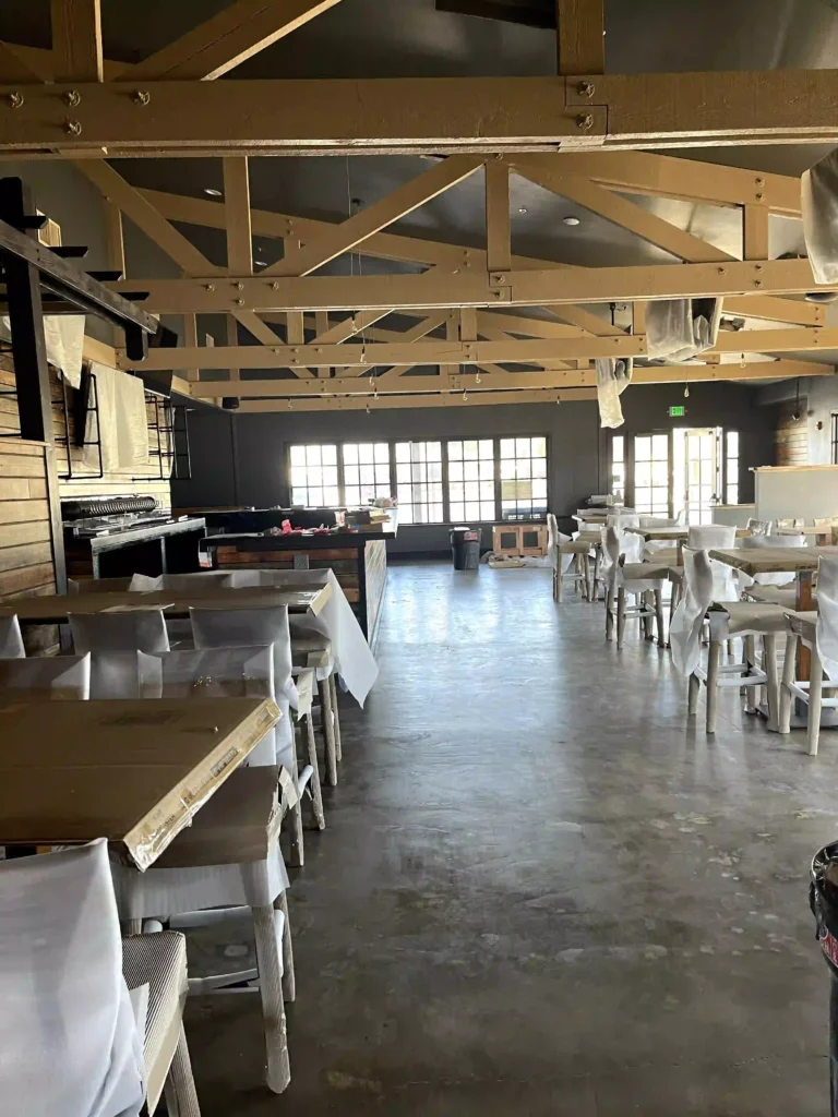 Restaurant build-out in progress with exposed truss ceiling wiring by Beckler Electric